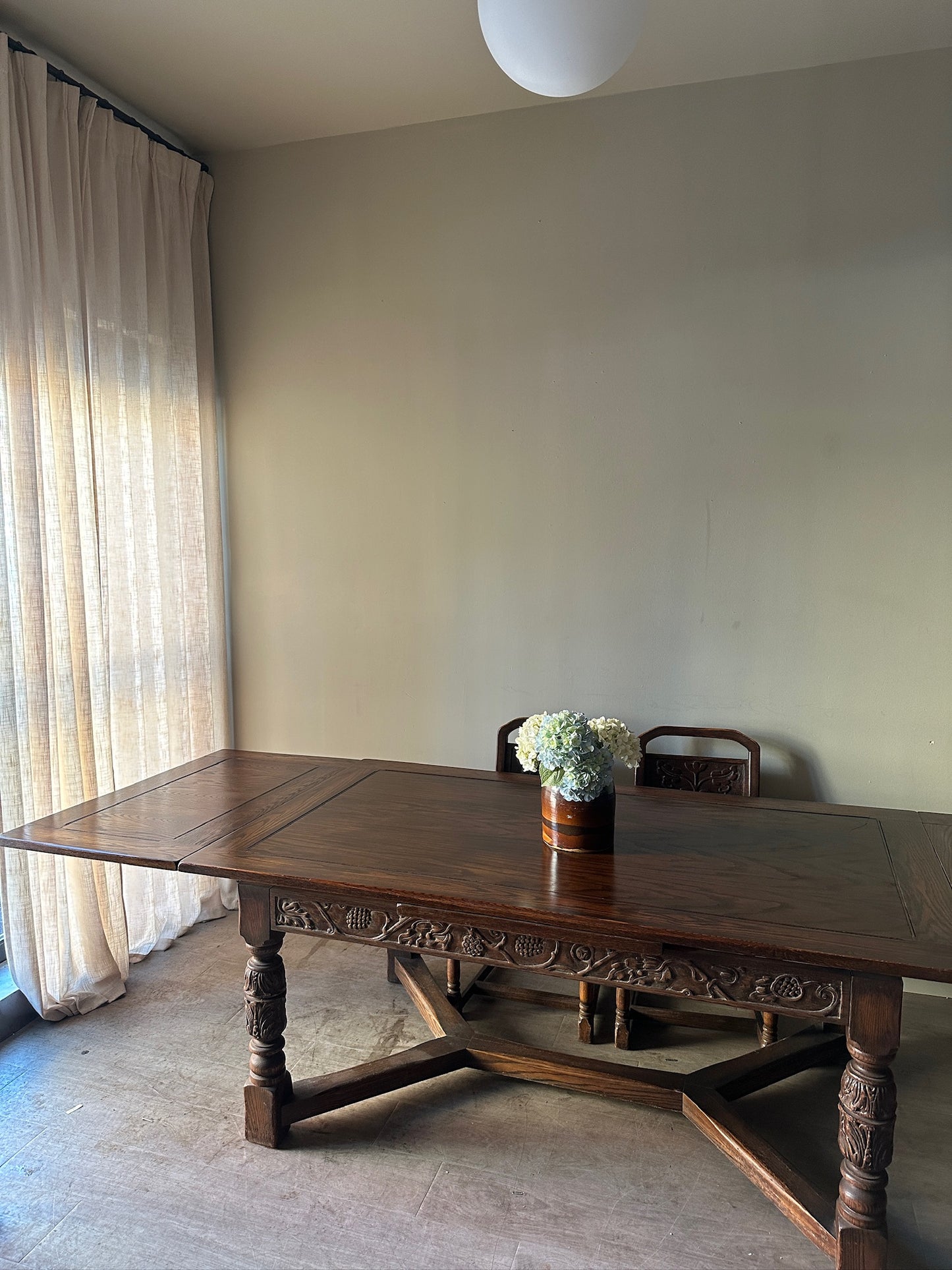 Oak Tudor revival dining table with extensions
