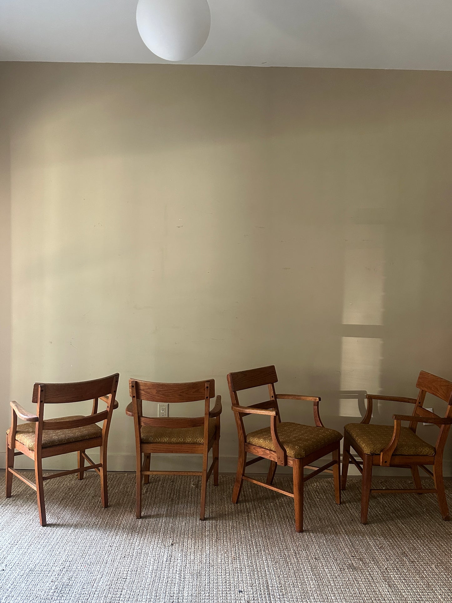 Oak arm chairs. Sold individually.