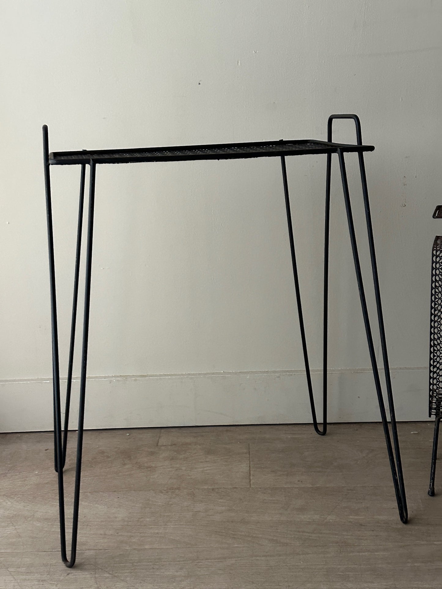 Black metal mesh side table (left)