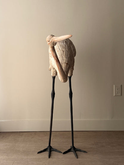 Wooden carved egret statue with iron legs