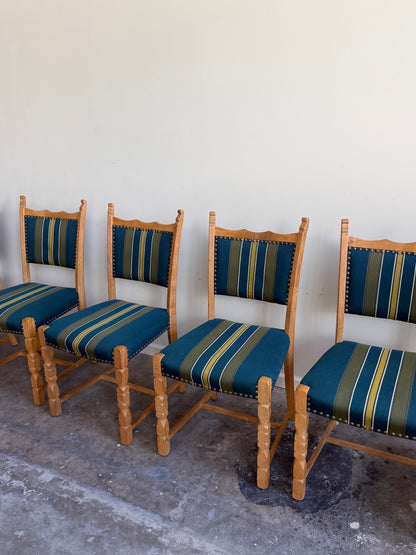 Henning Kjaernulf oak upholstered dining chairs. Sold in pairs.