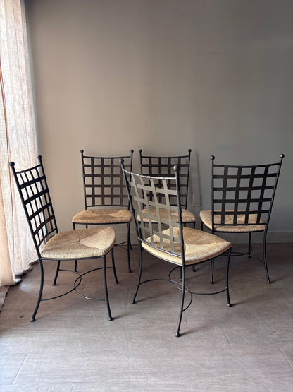 Wrought iron rush seat dining chairs. Sold individually.