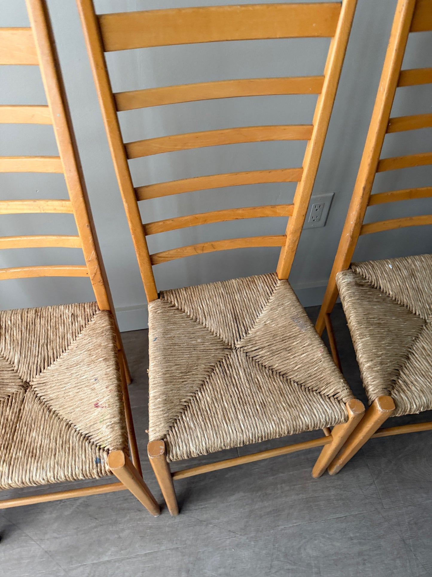 Maple ladder back dining chairs with rush seats. Sold in pairs.