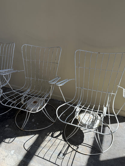 White swivel patio chairs. Sold individually.