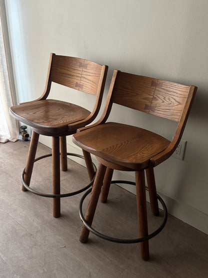 Conant Ball oak swivel bar stools. Sold as a pair.