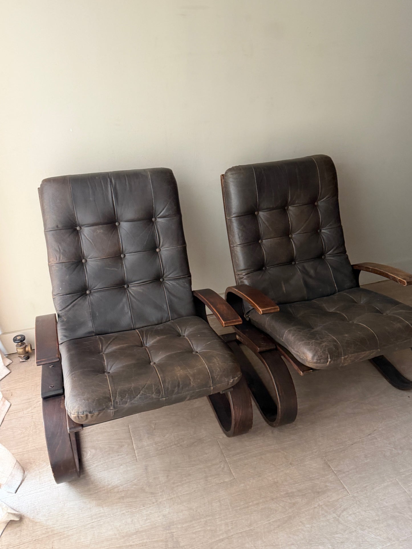 Danish beech bentwood and leather lounge chairs. Sold individually.