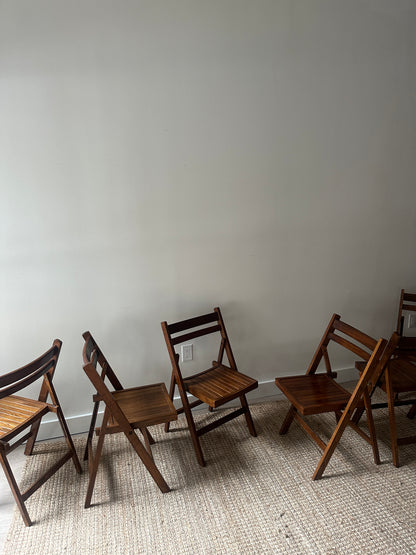 Oak folding chairs. Sold individually.