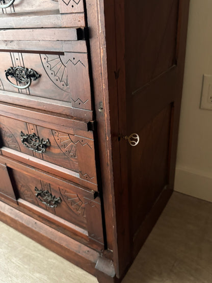 Carved Eastlake walnut dresser with side lock