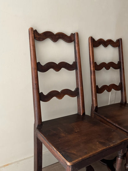 French oak ladder back dining chairs. Sold as a pair.