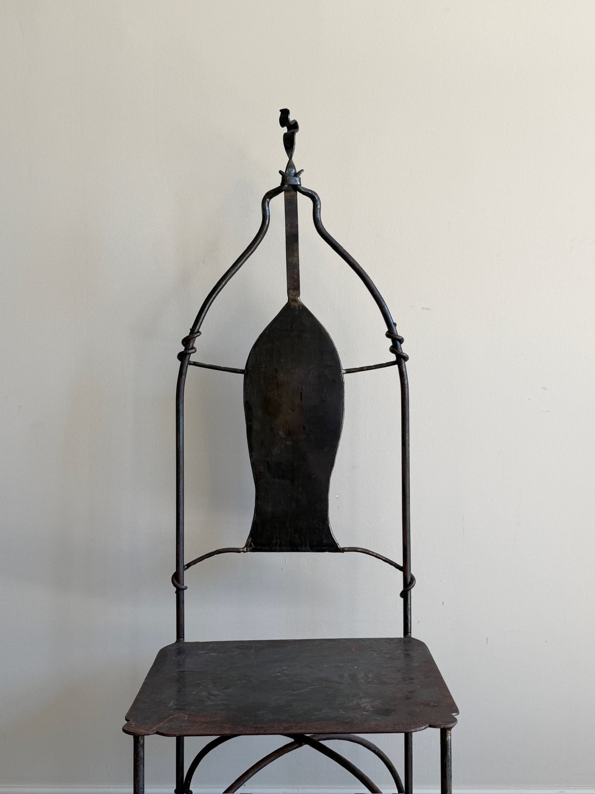 Wrought iron sculptural chairs (left)