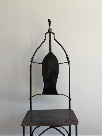 Wrought iron sculptural chairs (left)