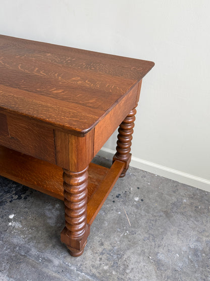 Golden oak spindle leg library table