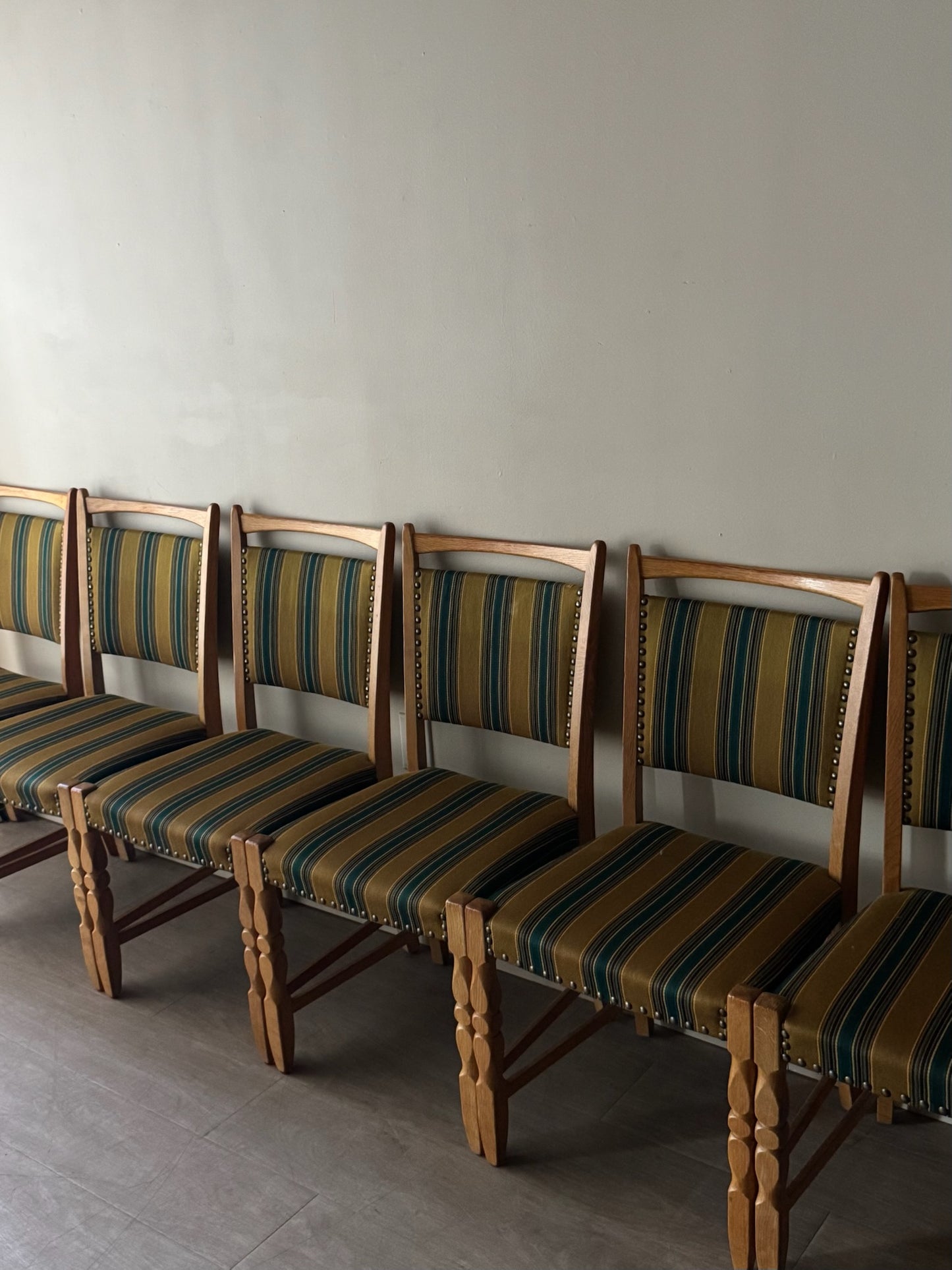 Danish oak dining chairs with striped upholstery. Sold in pairs.