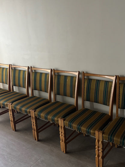 Danish oak dining chairs with striped upholstery. Sold in pairs.