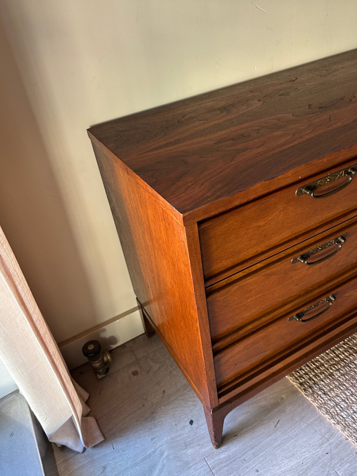 Walnut credenza with carved center handles