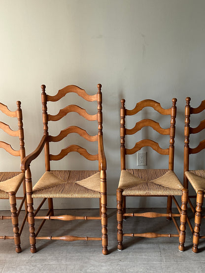 Set of 4 maple and rush dining chairs. 3 armless, 1 arm. Sold as set