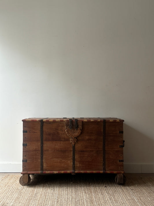 Large wooden chest on castors
