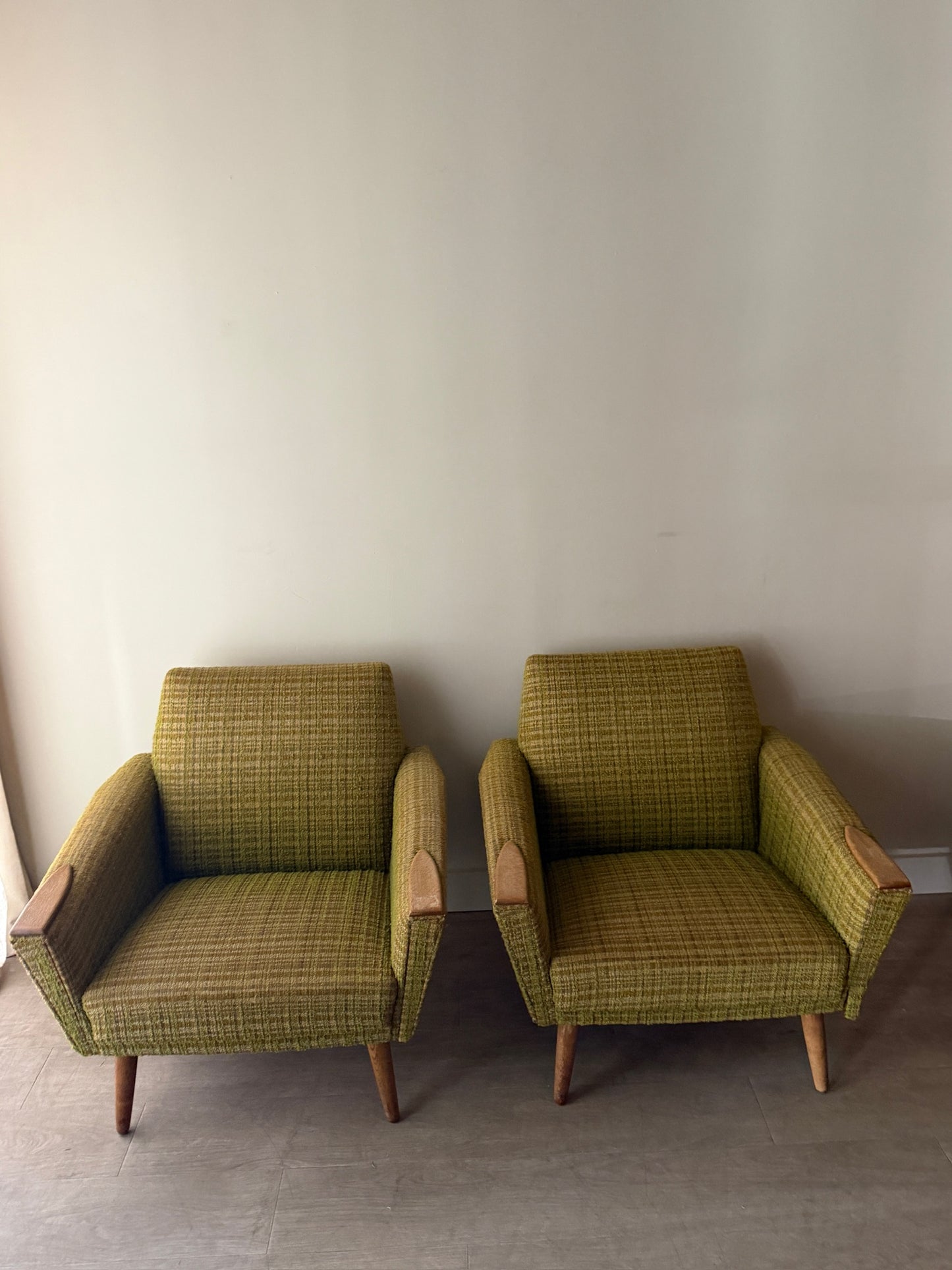 Green plaid Danish lounge chairs. Sold individually.