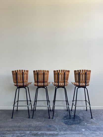 Slatted maple swivel bar stools. Sold in pairs.
