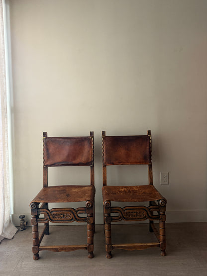 Spanish leather and oak chairs. Sold individually.