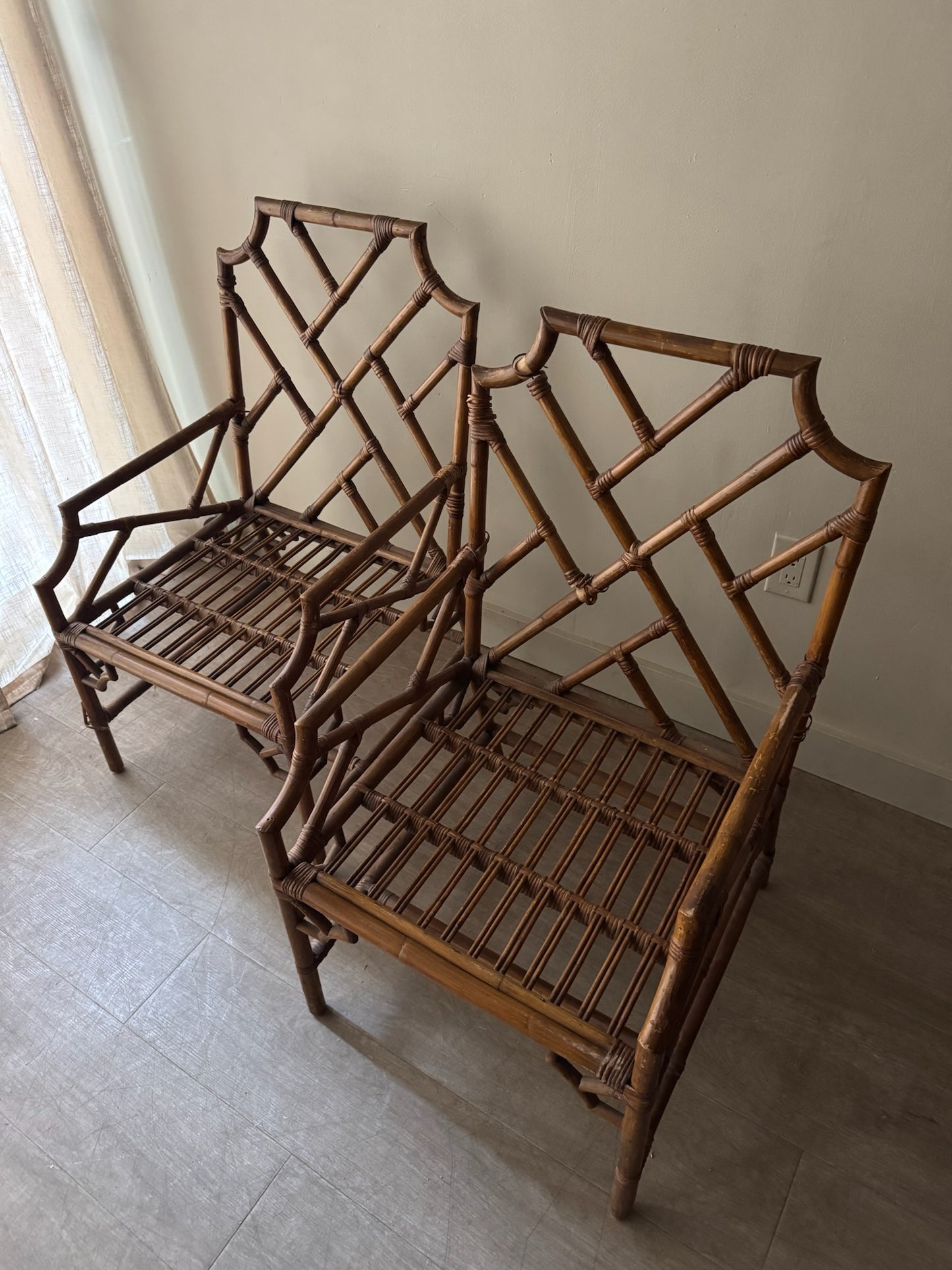 Bamboo arm chairs. Sold individually.