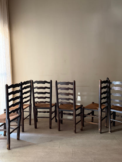 English provincial elmwood ladder back rush seat chairs. Sold in pairs.