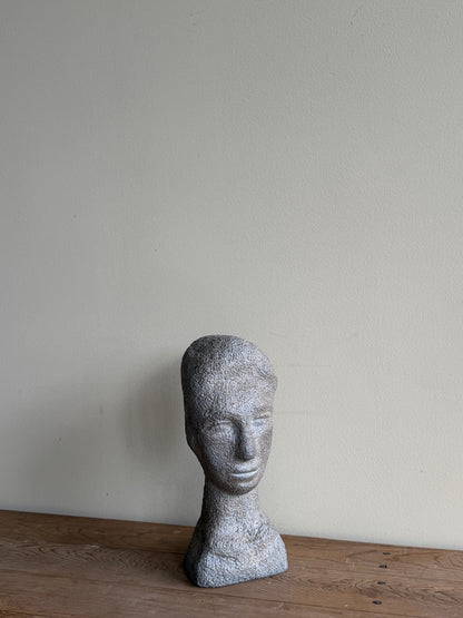 Carved stone double-sided bust