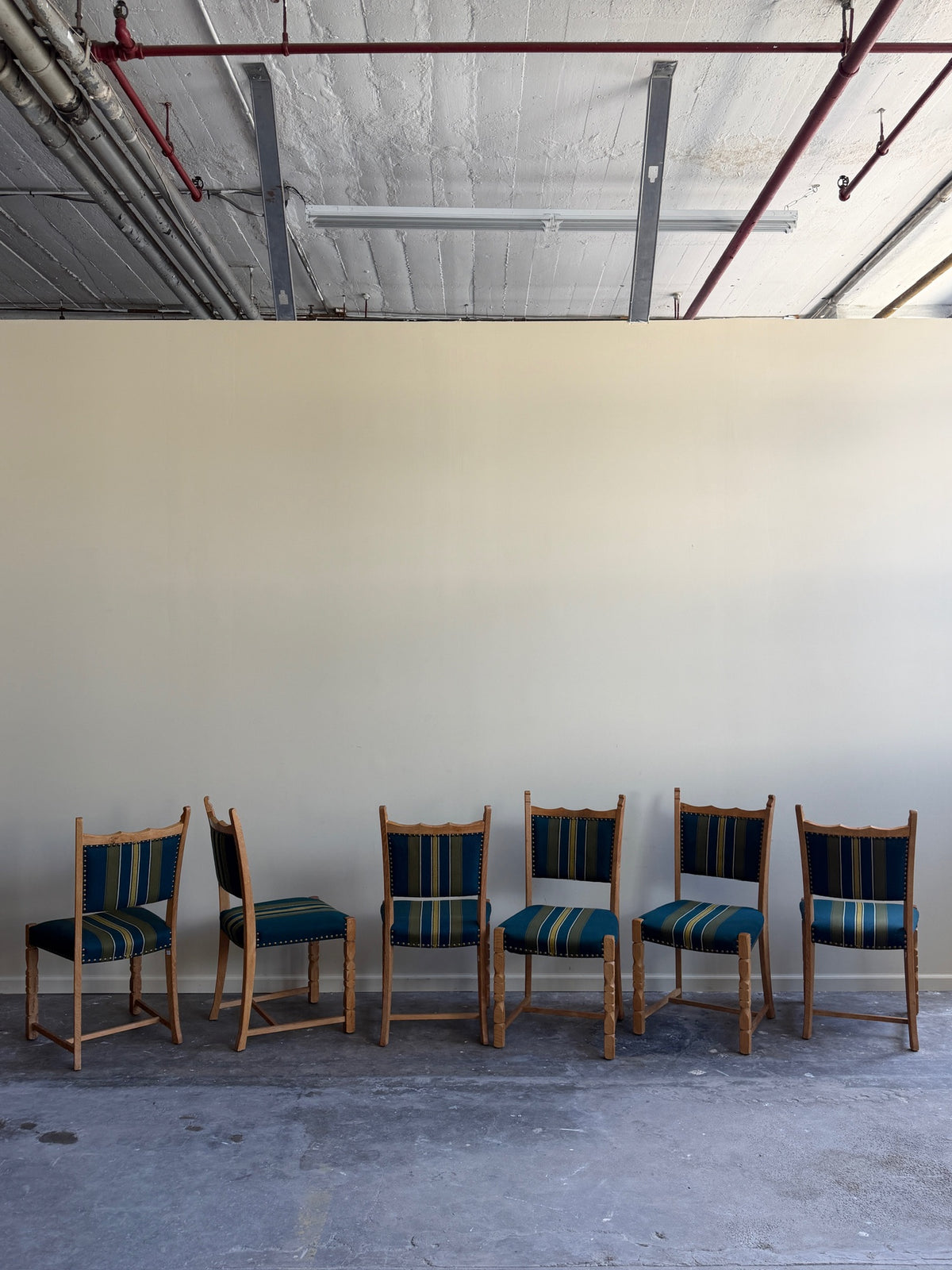 Henning Kjaernulf oak upholstered dining chairs. Sold in pairs.