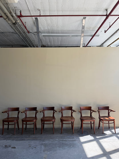 Thonet bentwood arm chairs. Sold in pairs.