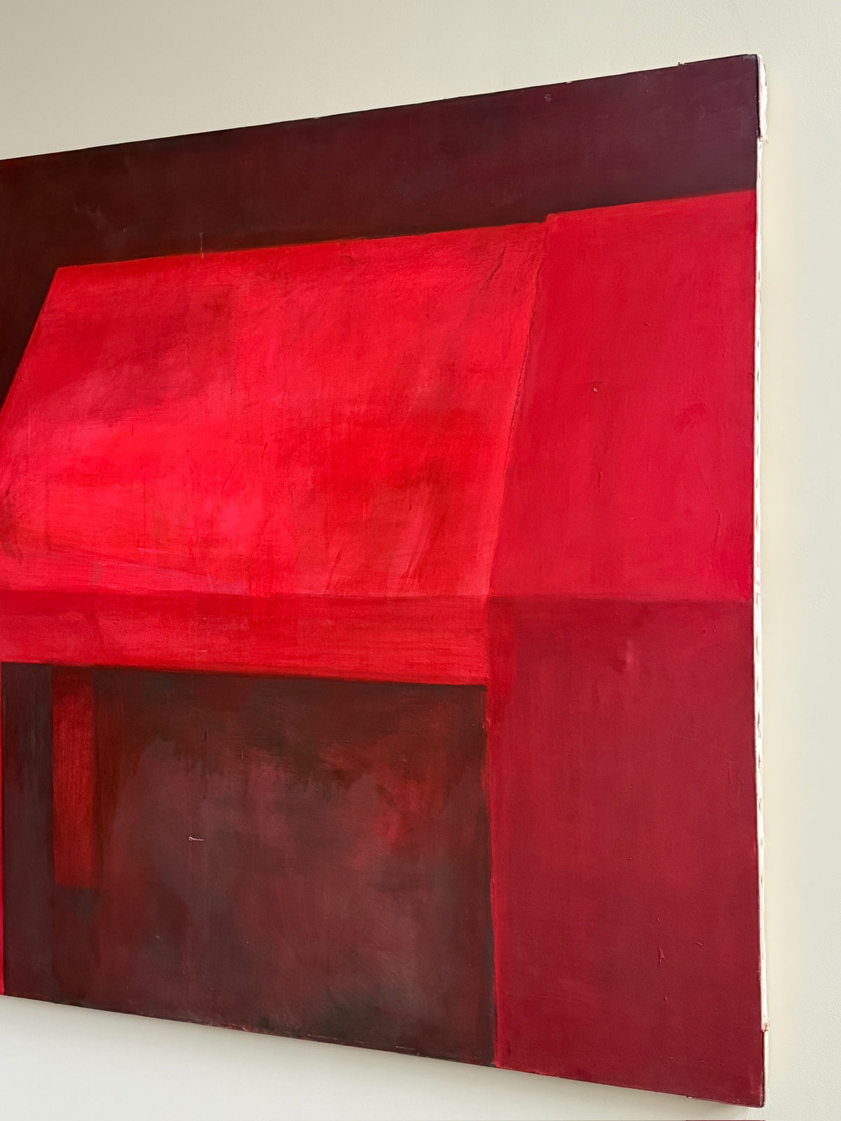 Large red abstract. Signed “Caycedo.”