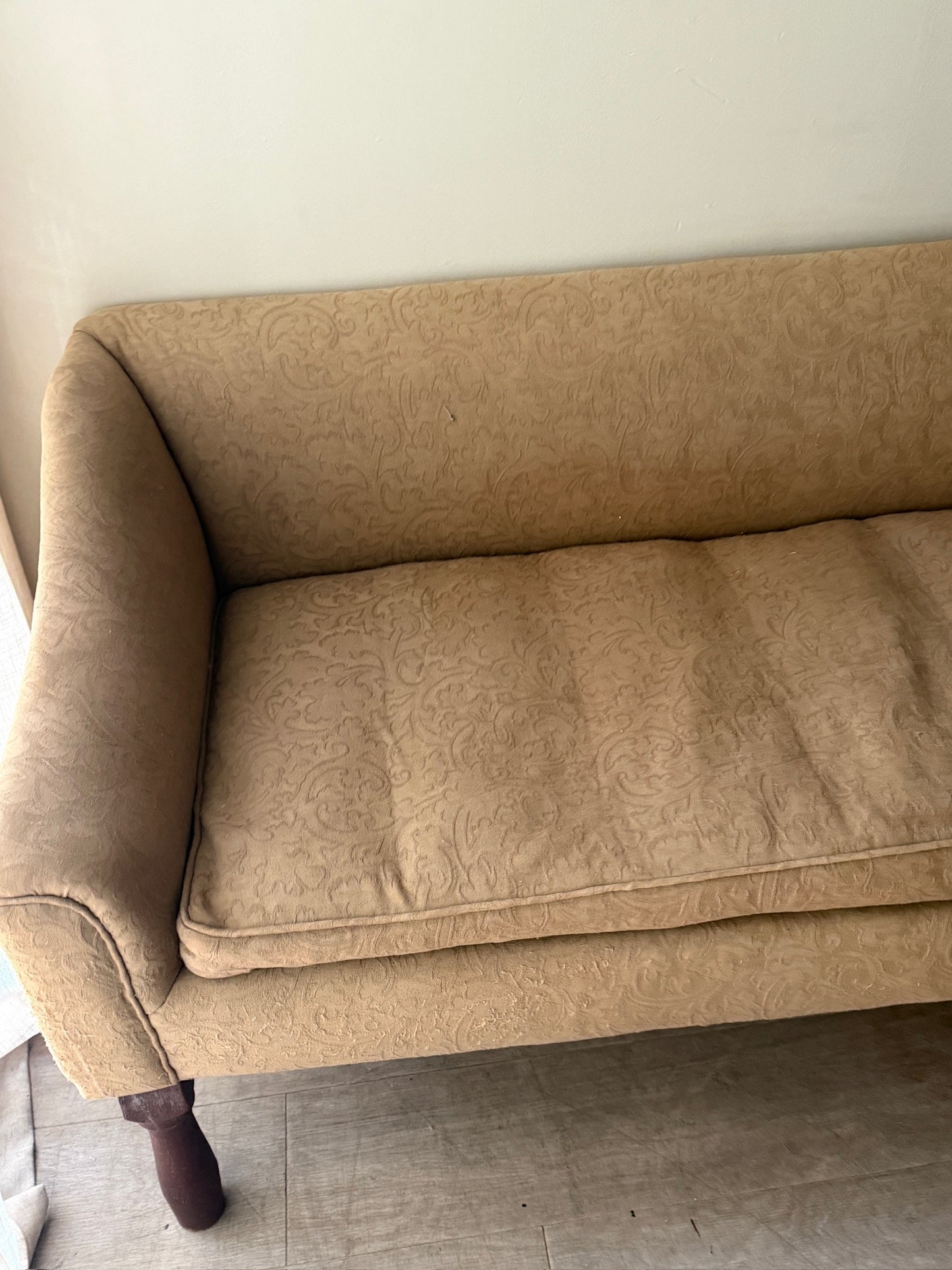 Damask upholstered settee with turned walnut legs