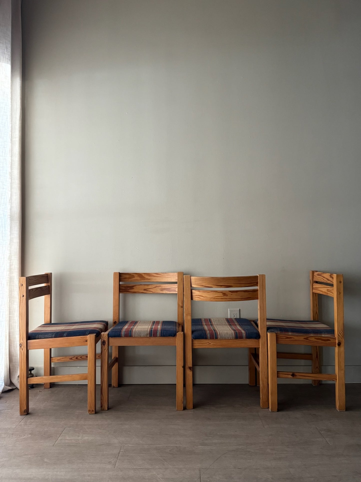 Danish pine plaid upholstered dining chairs. Sold in pairs.