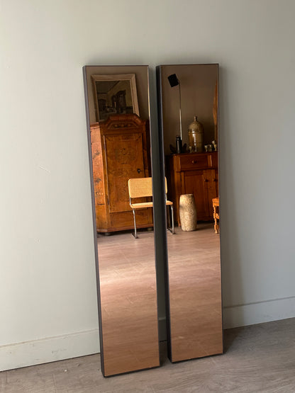 Pair of copper tinted wall mirrors. Sold together.