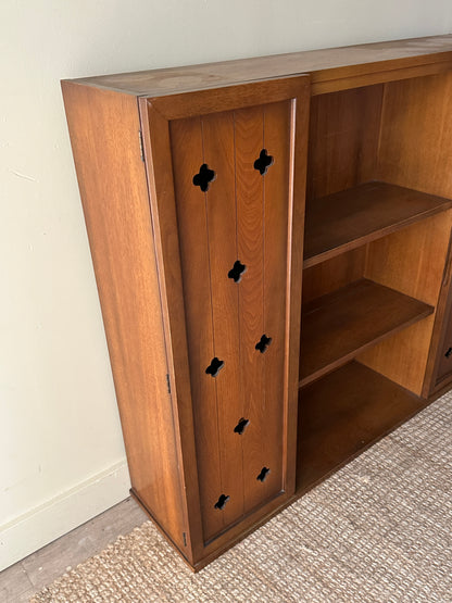 Walnut bookcase with cutouts