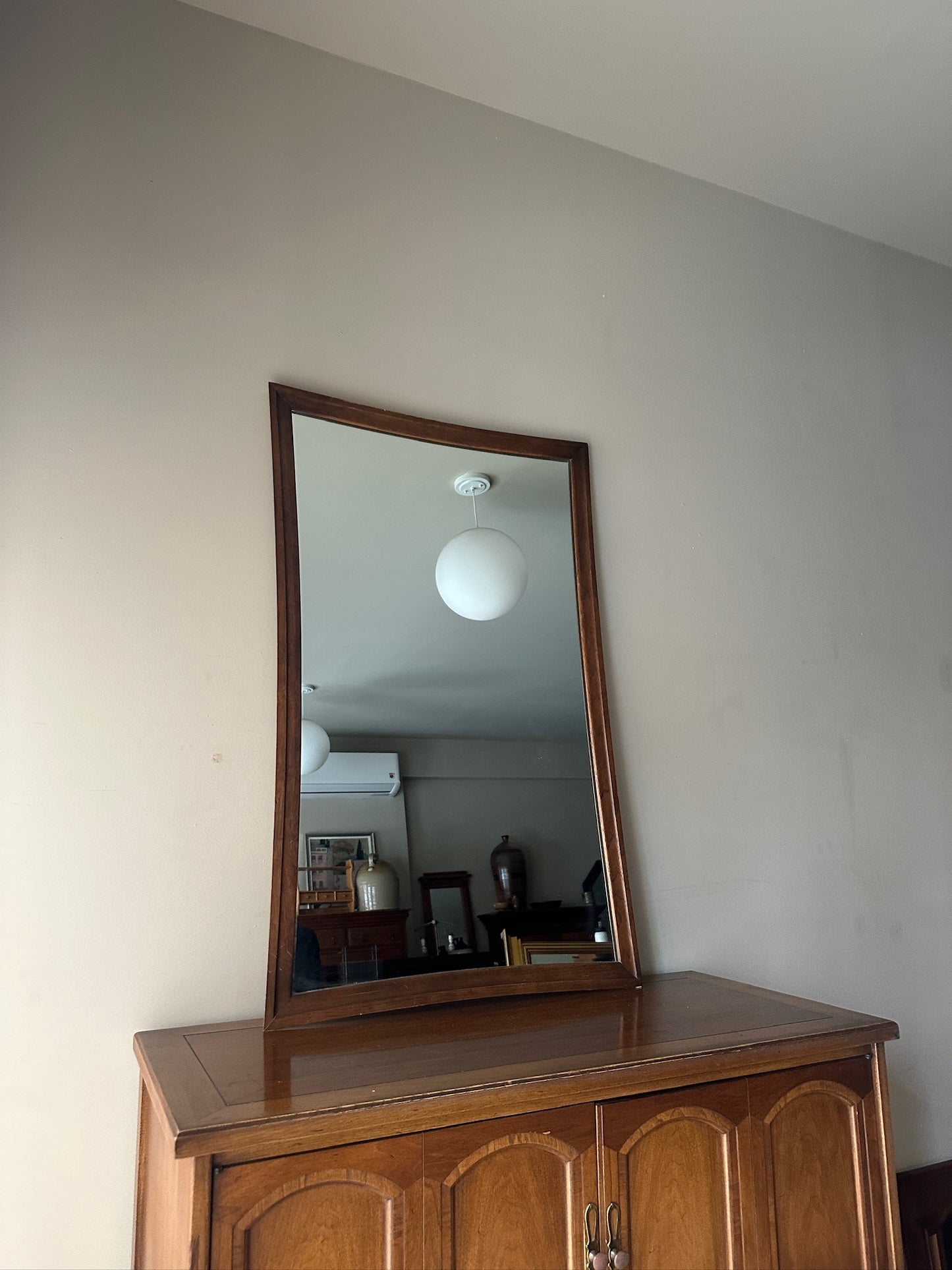 Serpentine walnut mirror