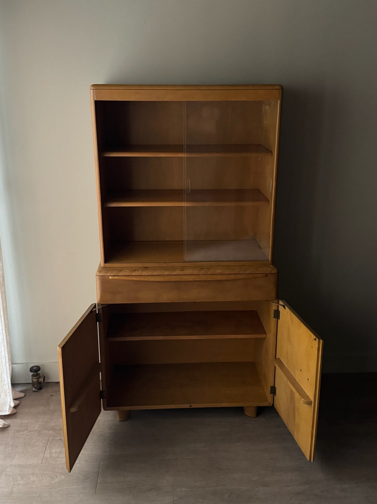 Heywood Wakefield maple two piece display cabinet