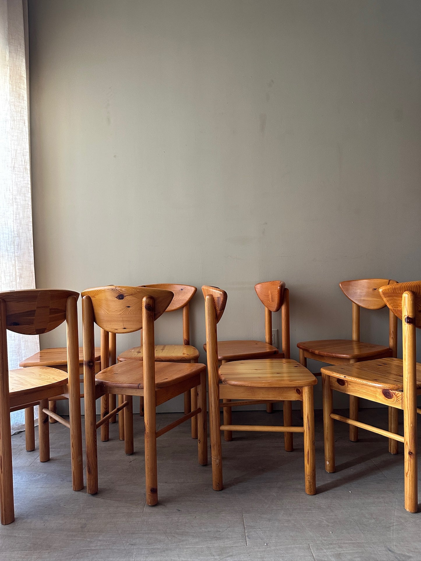 Rainer Daumiller pine cat-eye dining chairs. Sold in sets of 2.