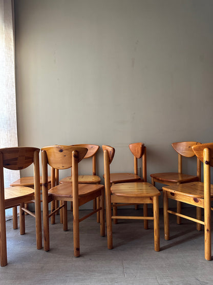 Rainer Daumiller pine cat-eye dining chairs. Sold in sets of 2.