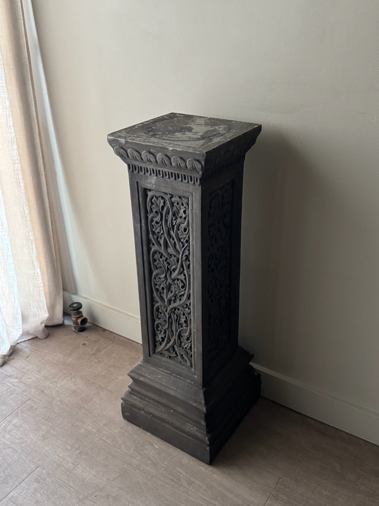 Carved pedestal