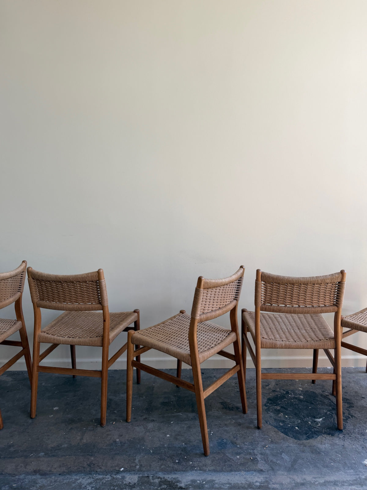 Danish oak and papercord chairs. Sold individually.