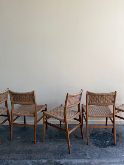 Danish oak and papercord chairs. Sold individually.