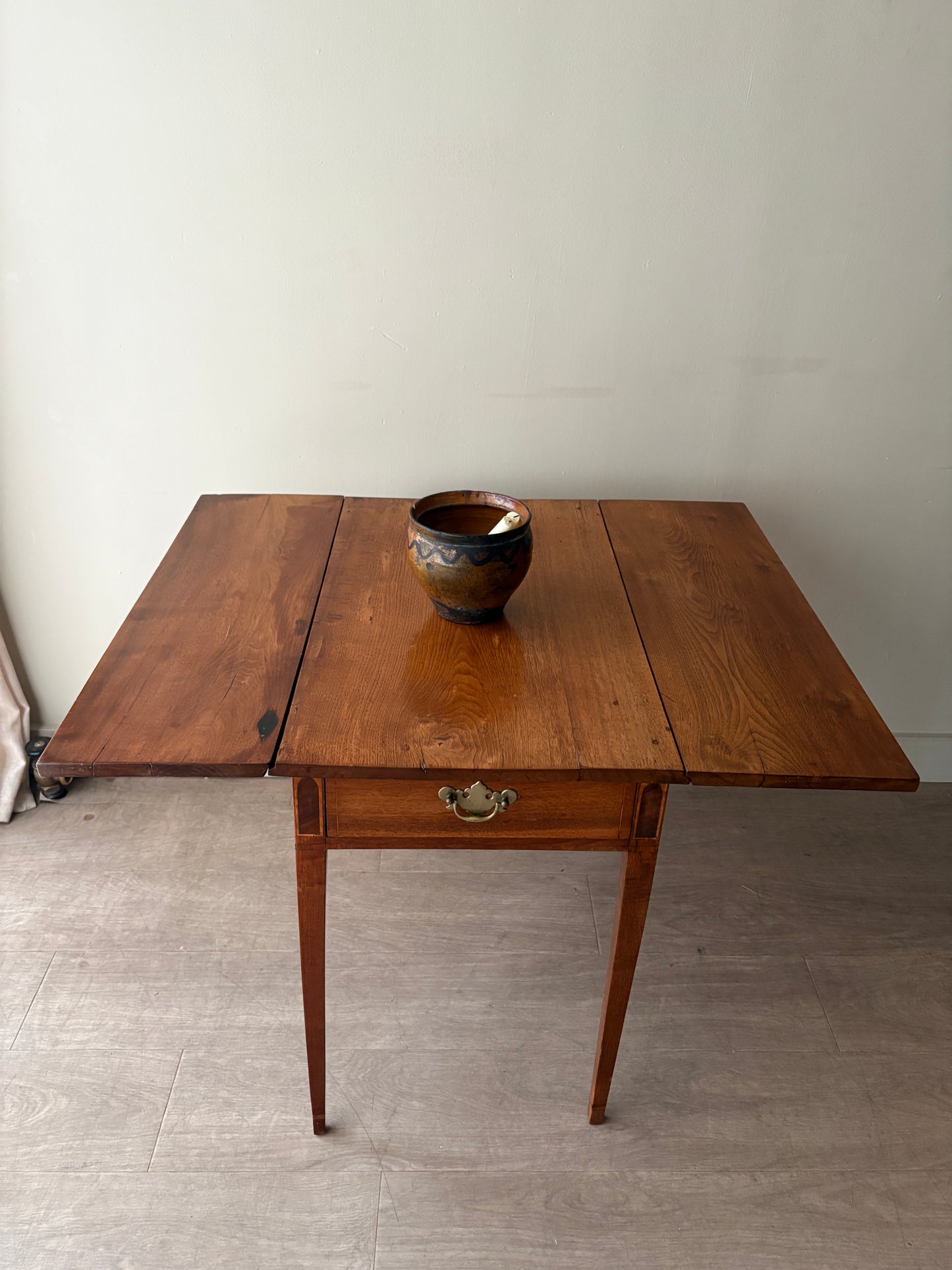 Inlaid walnut drop leaf table