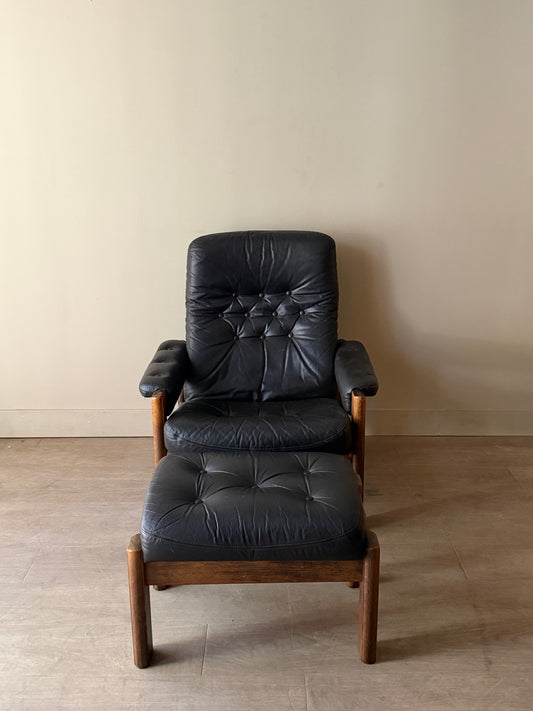 Reclining leather armchair with ottoman