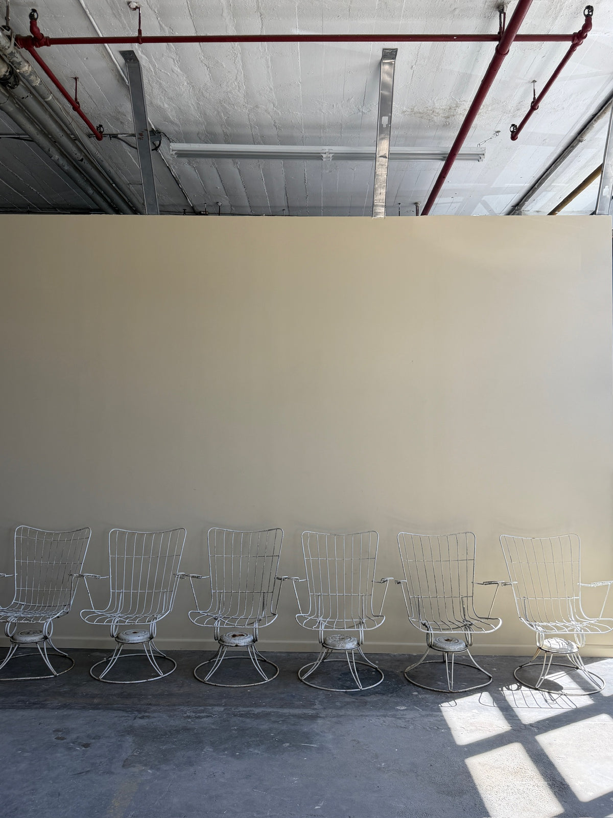 White swivel patio chairs. Sold individually.