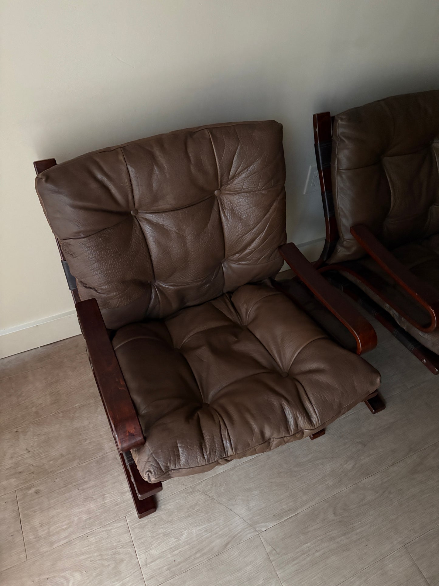 Einar Hove Norwegian brown leather lounge chairs. Sold individually.
