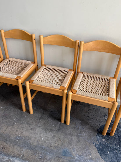 Maple dining chairs with twisted rope seats. Sold in pairs.