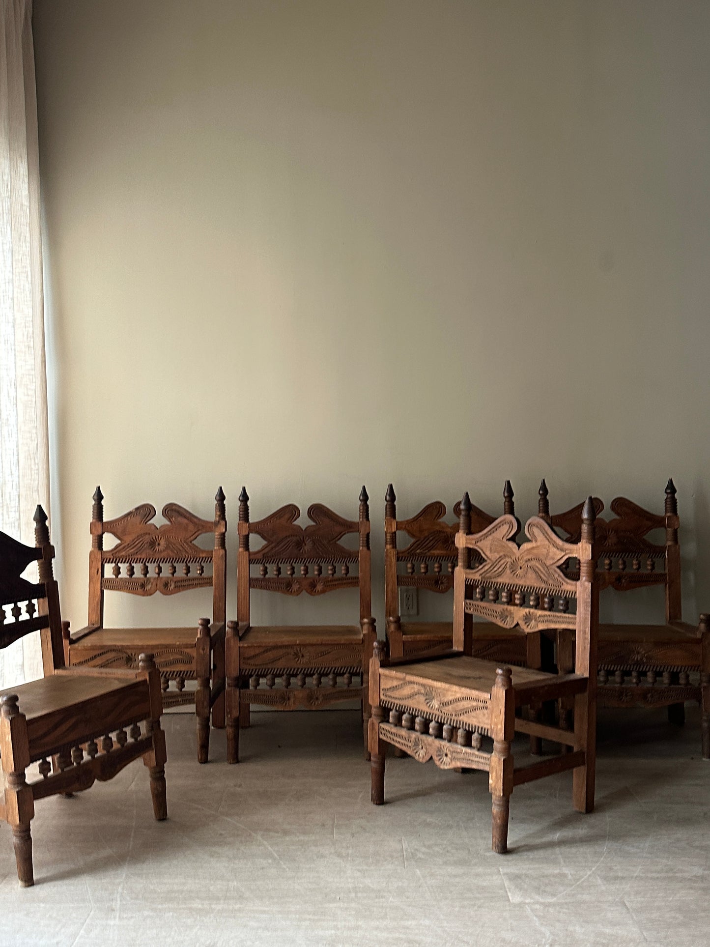 6 hand carved chairs. Sold individually.