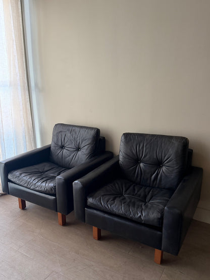 Danish black leather lounge chairs. Sold individually.