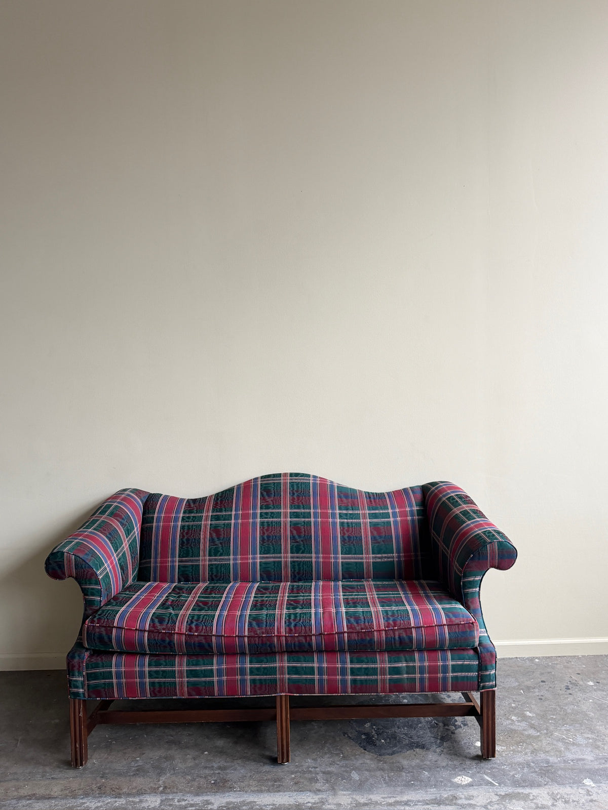 Camelback loveseat in plaid moiré upholstery