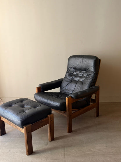 Reclining leather armchair with ottoman